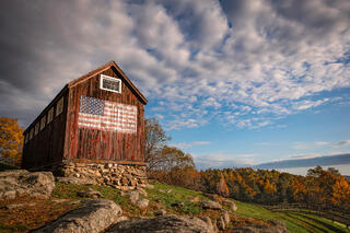 A Red Barn with an American Flag